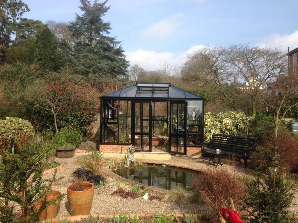 Bespoke black greenhouse with hipped roof in Norfolk