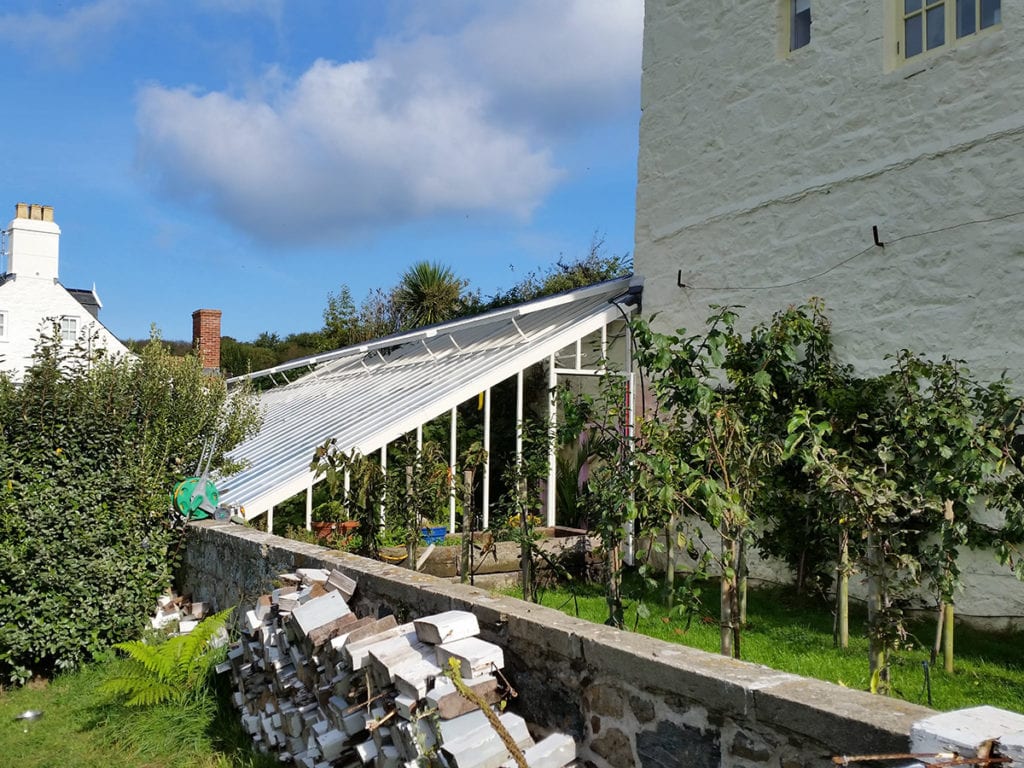 Bespoke aluminium lean-to greenhouse in Guernsey